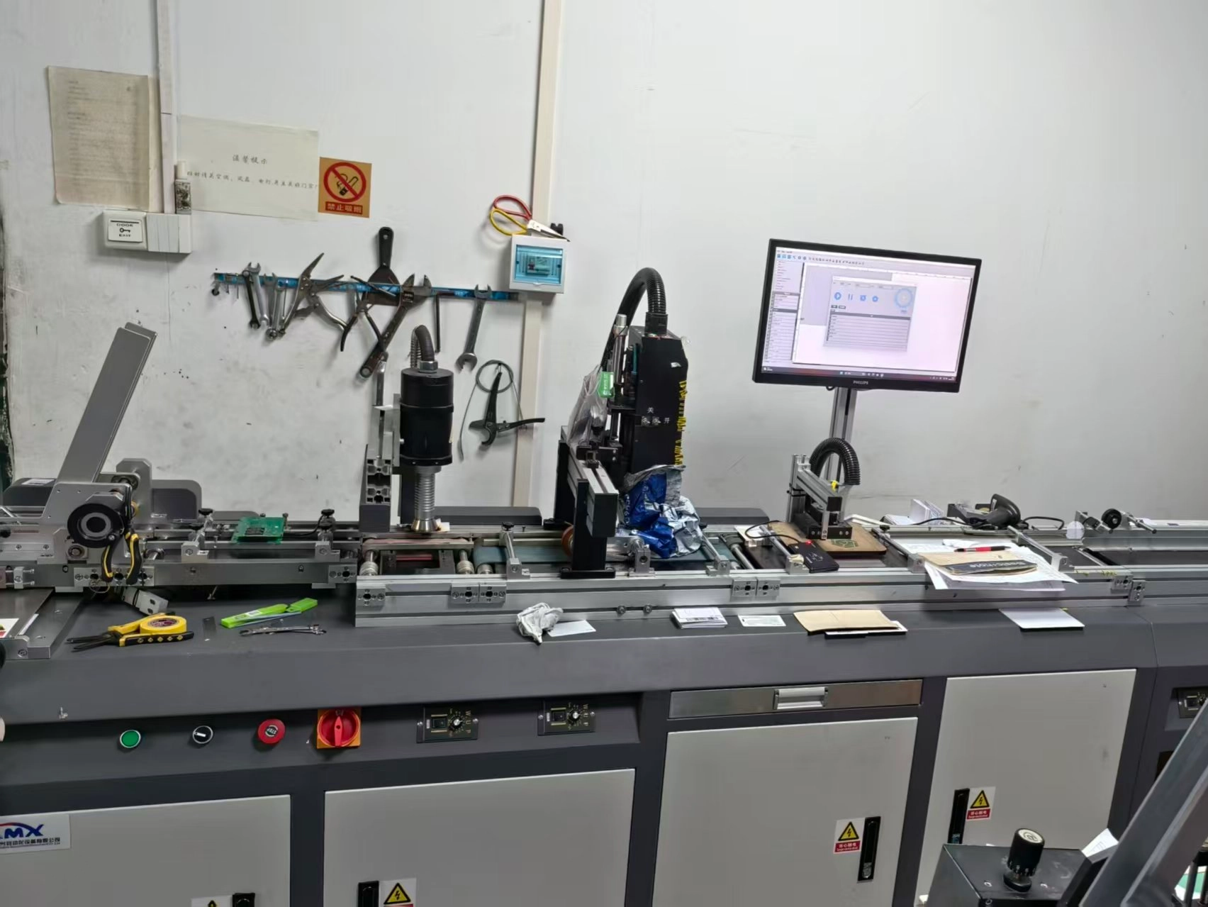 Industrial quality control station illustrating the automated verification between a printed barcode and its corresponding encoded RFID chip data Industrial quality control station illustrating the automated verification between a printed barcode and its corresponding encoded RFID chip data